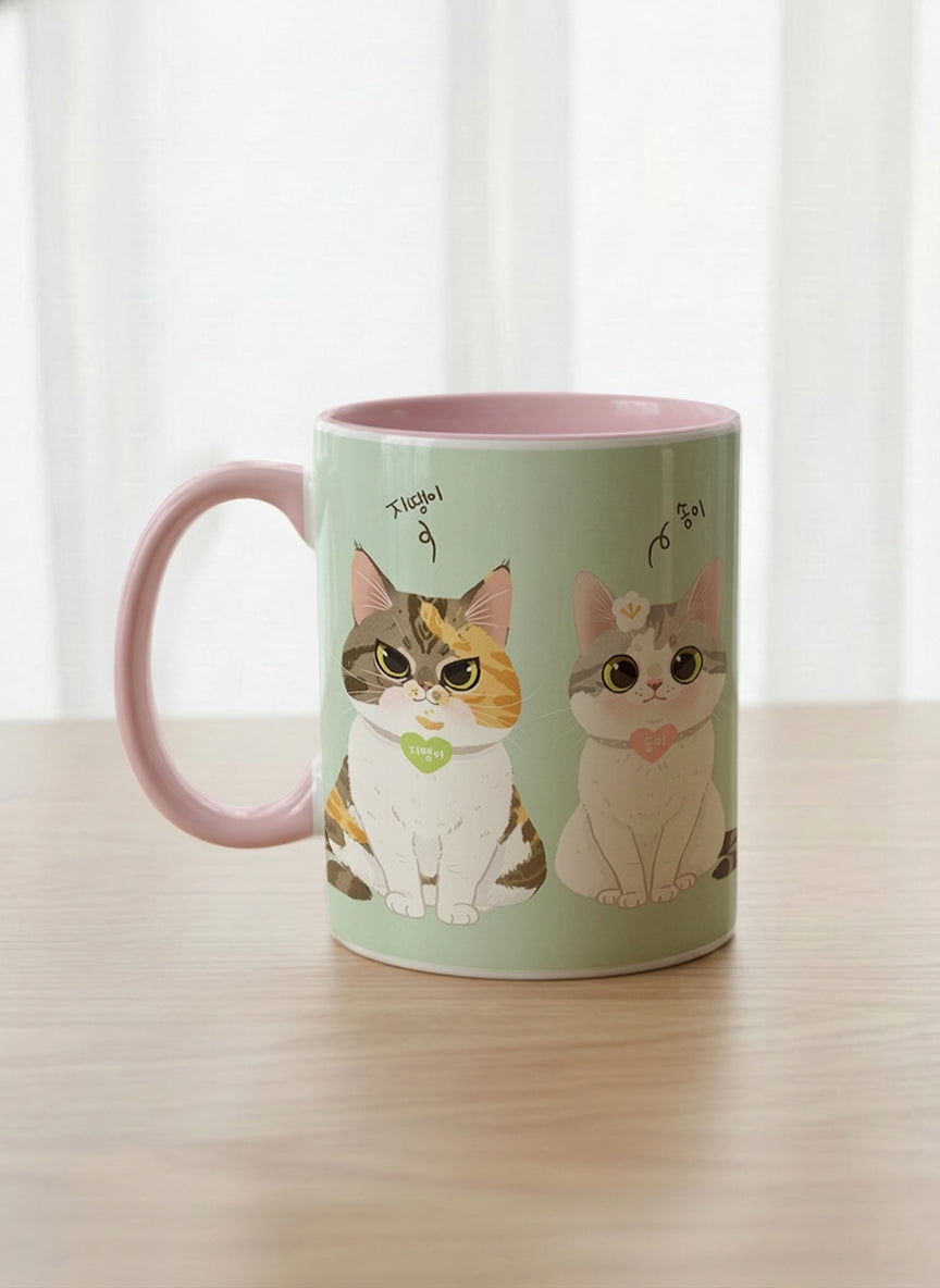 Classic Mug | The Perfect Pair left view mug two cats with Korean name tags and bow ties on mint green, blush pink interior, by Hyun Jung Cho