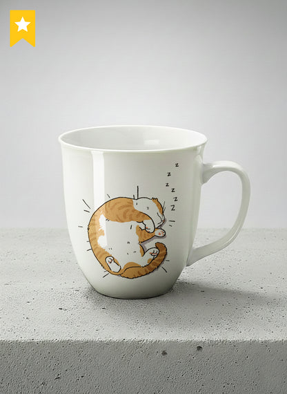 Ronny Mug | Sweet Dreams mug, a ginger tabby cat curled into a perfect circle fast asleep with tiny zzz's floating above, clean white interior and handle, by Hyun Jung Cho - Gallery By Inhesion