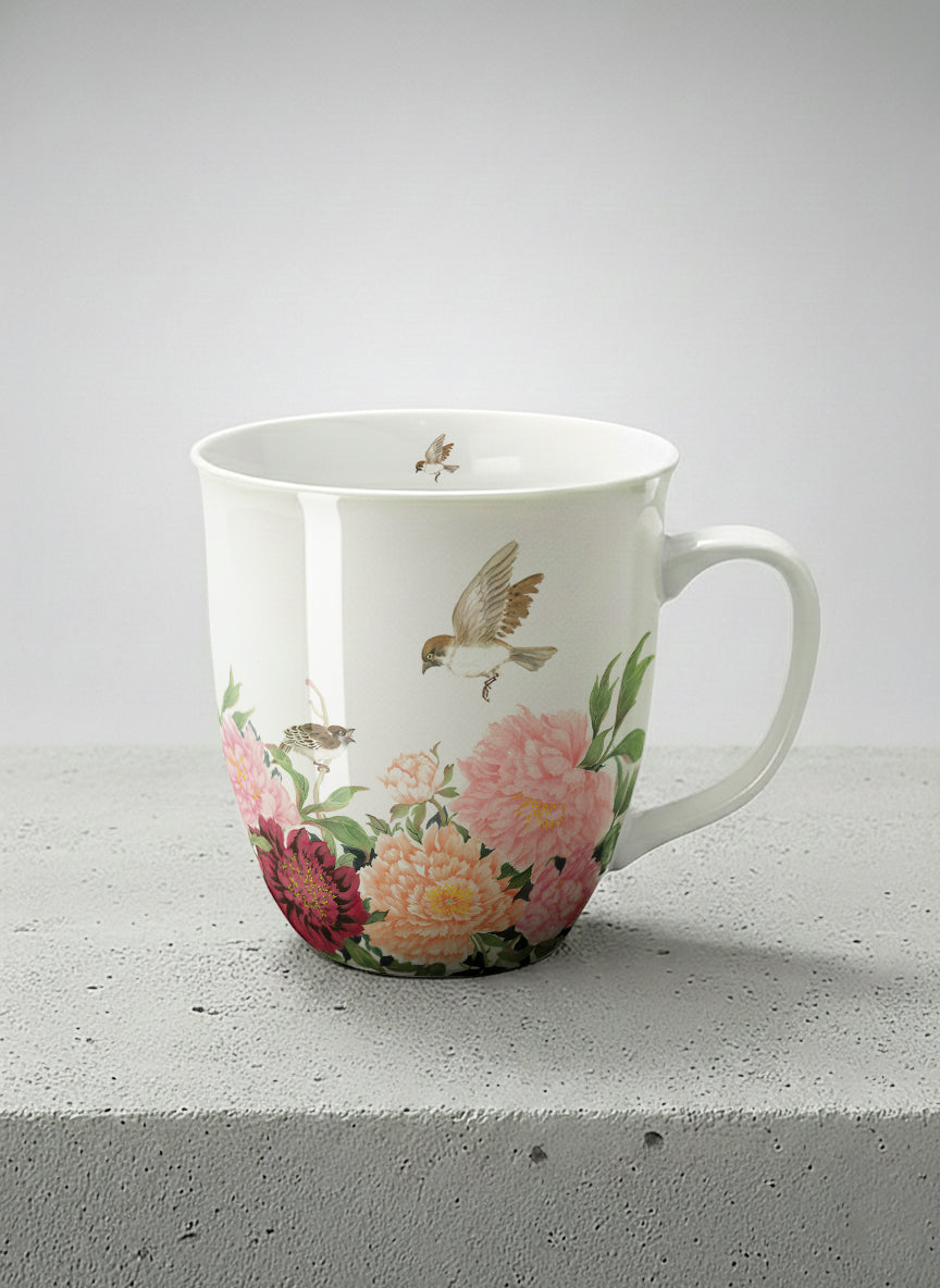 Ronny Mug | A Tapestry of Flowers mug with watercolor bird flying amid pink/red flowers by Alice Wong - Gallery By Inhesion