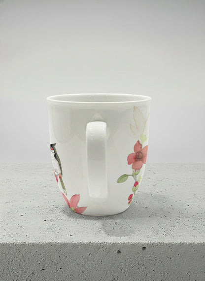 Ronny Mug | The Radiance of Red Kapok side view mug with watercolor illustration of a red bird and pink flowers artwork by Alice Wong - Gallery By Inhesion