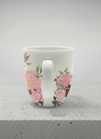 Ronny Mug | A Tapestry of Flowers side view mug with watercolor bird flying amid pink/red flowers by Alice Wong - Gallery By Inhesion