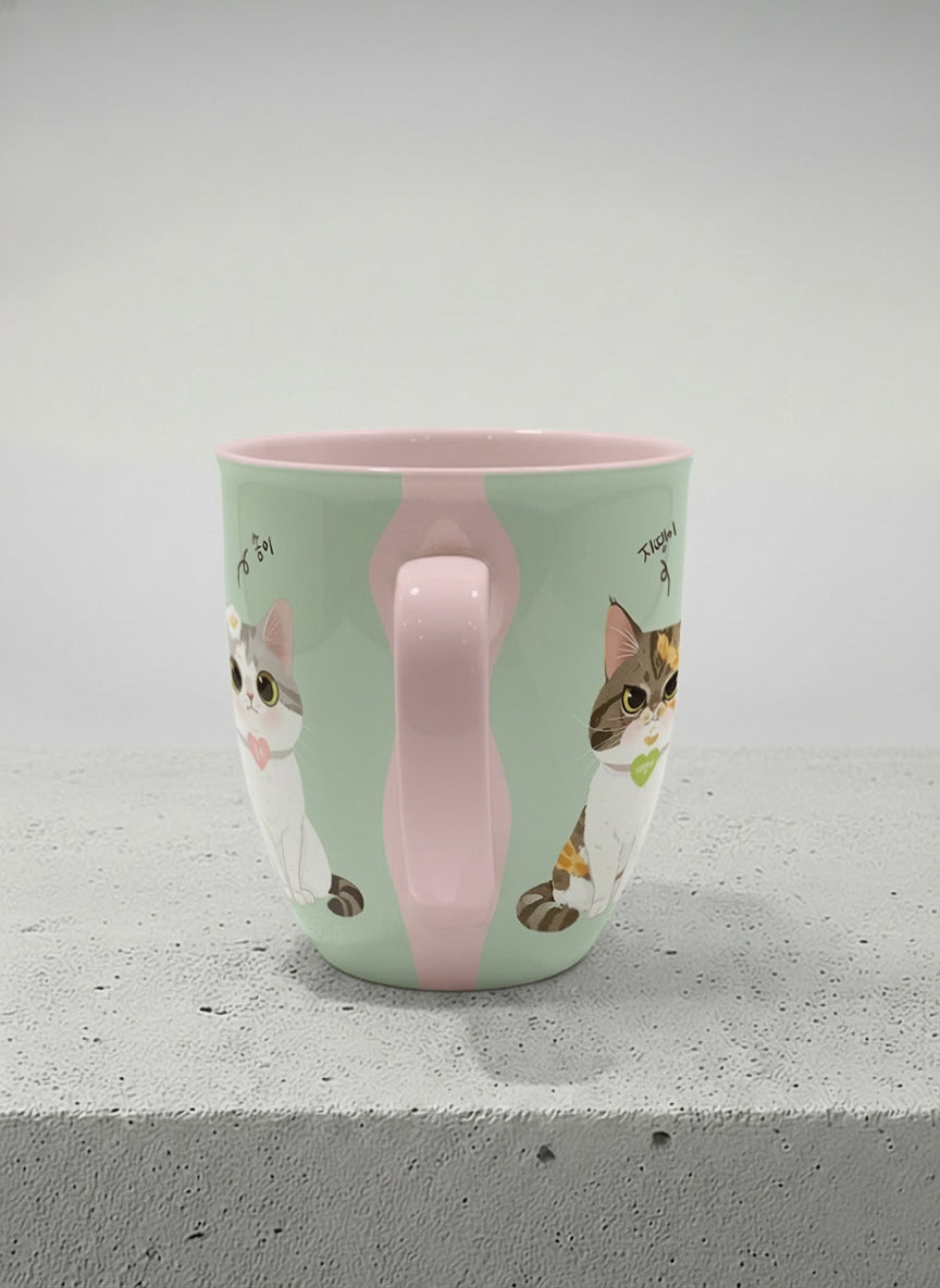 ronny mug | The Perfect Pair side view mug two cats with Korean name tags and bow ties on mint green, blush pink interior, by Hyun Jung Cho