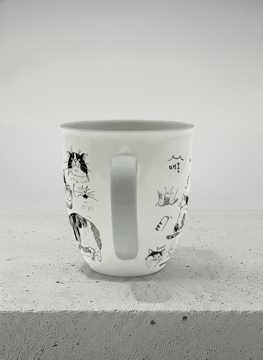 Ronny mug | Moments of Curiosity side view mug  ink-sketched cats in playful poses with Korean script on white, grey interior, by Hyun Jung Cho