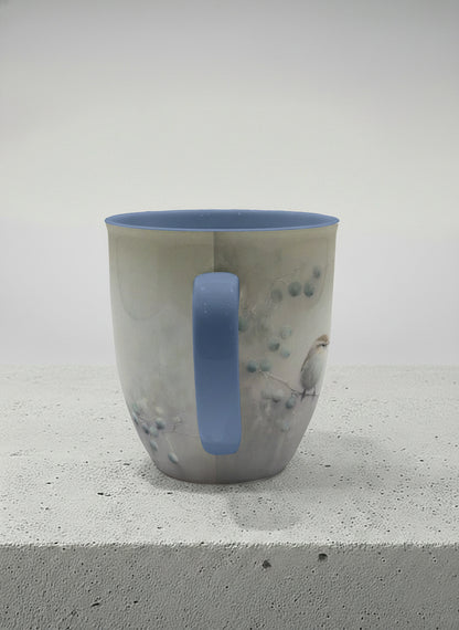 ronny mug | A Quiet Moment side view mug,solitary bird perched in a soft misty landscape with delicate dot details, dusty blue interior and handle, by Karina Mosser - Gallery By Inhesion