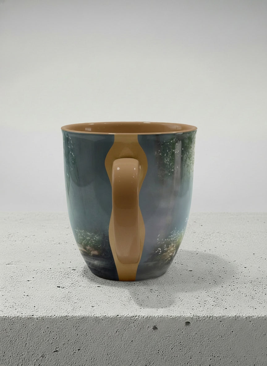 ronny mug | Serenity Stream side view mug, an enchanted forest with glowing light filtering through misty teal trees and wildflowers by a stream, warm olive interior and handle, by Karina Mosser - Gallery By Inhesion