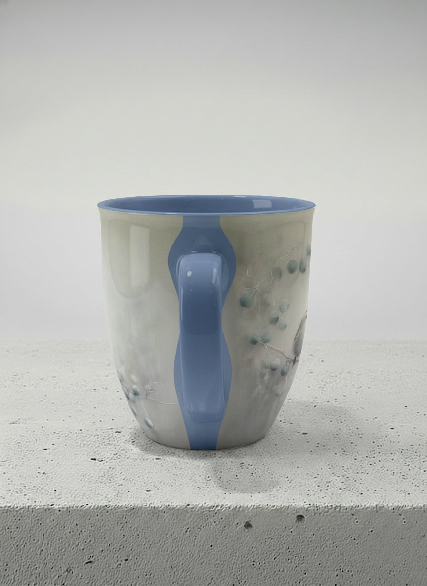 Ronny mug | A Quiet Moment side view mug, solitary bird perched in a soft misty landscape with delicate dot details, dusty blue interior and handle, by Karina Mosser - Gallery By Inhesion