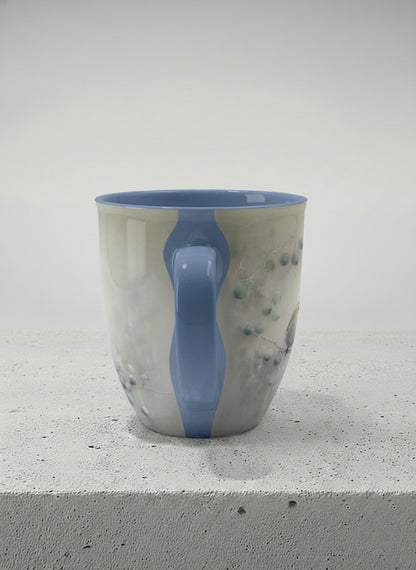 Ronny mug | A Quiet Moment side view mug, solitary bird perched in a soft misty landscape with delicate dot details, dusty blue interior and handle, by Karina Mosser - Gallery By Inhesion