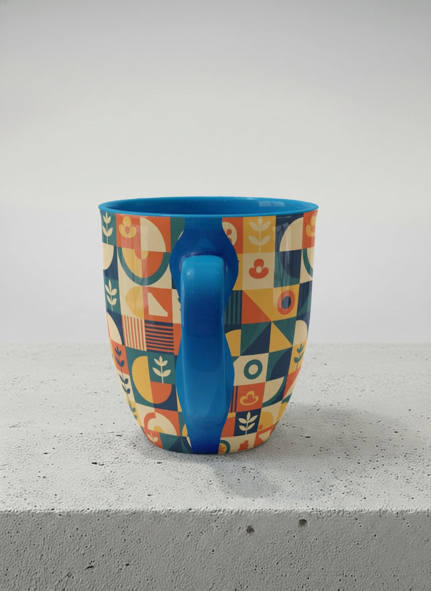 Ronny Mug | Bloom Across Realities side view mug, bold geometric pattern, blue interior and handle, concrete surface  by Alan CL Lee - Gallery By Inhesion