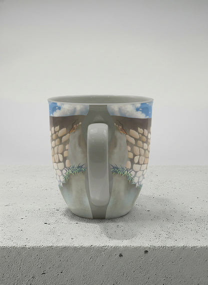 Ronny Mug | The Timeless Facade side view mug ancient stone walls rising under a bright blue sky with soft drifting clouds, clean pearl white interior and handle,  by Samuel Kwok Gallery By Inhesion