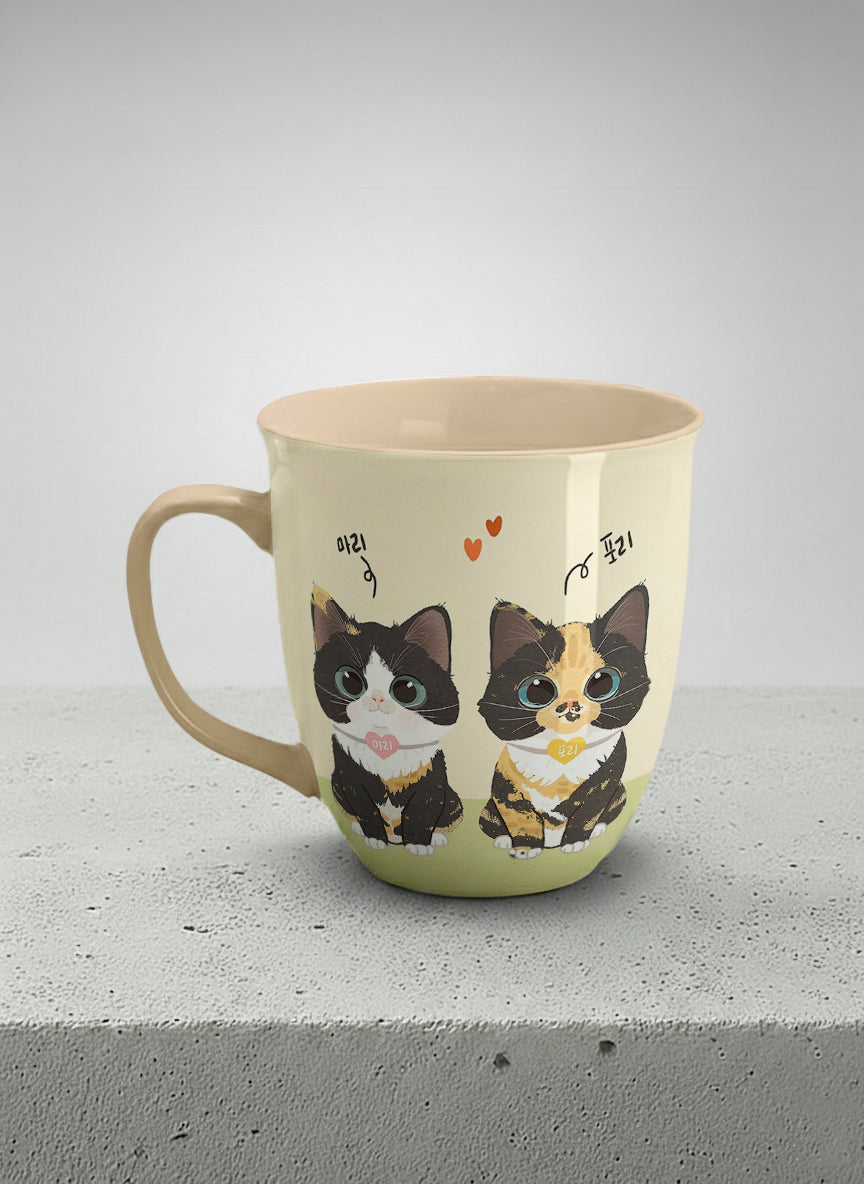 ronny mug | Our Precious Pair left view mug, two adorable tuxedo cats side by side with Korean name tags and tiny red hearts, soft cream interior and handle, by Hyun Jung Cho - Gallery By Inhesion