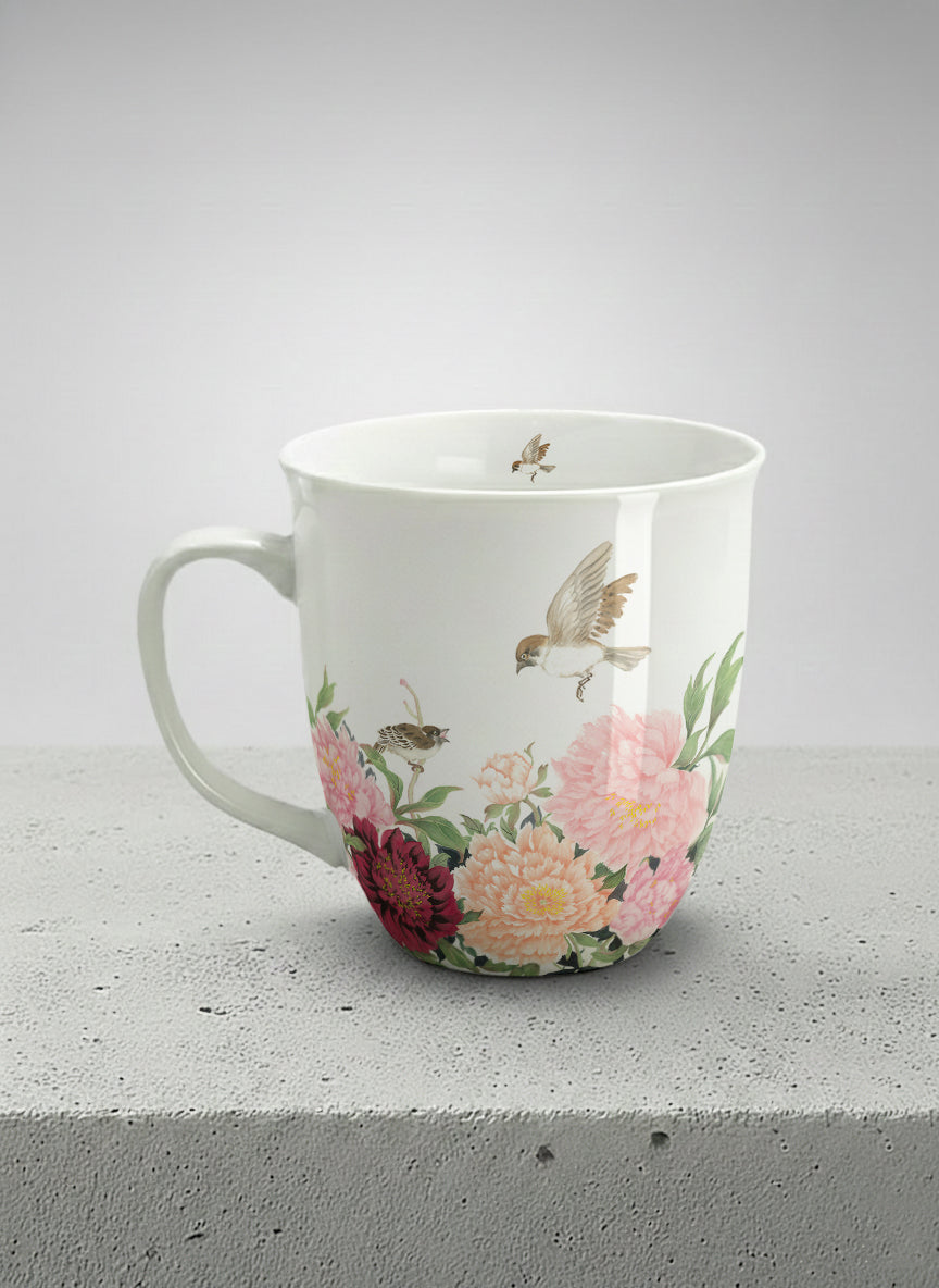 Ronny Mug | A Tapestry of Flowers left view mug with watercolor bird flying amid pink/red flowers by Alice Wong - Gallery By Inhesion