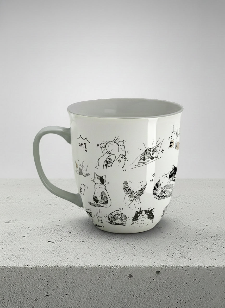 Ronny mug | Moments of Curiosity left view mug  ink-sketched cats in playful poses with Korean script on white, grey interior, by Hyun Jung Cho