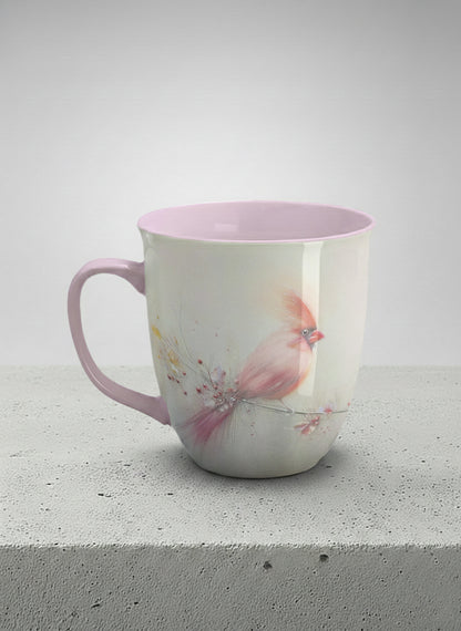 ronny mug | lossom Visitor left view mug, a delicate pink cardinal perched on a wispy blossom branch against a soft ivory mist, blush pink interior and handle, by Karina Mosser - Gallery By Inhesion
