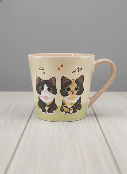 Conical mug | Our Precious Pair mug, two adorable tuxedo cats side by side with Korean name tags and tiny red hearts, soft cream interior and handle, by Hyun Jung Cho - Gallery By Inhesion