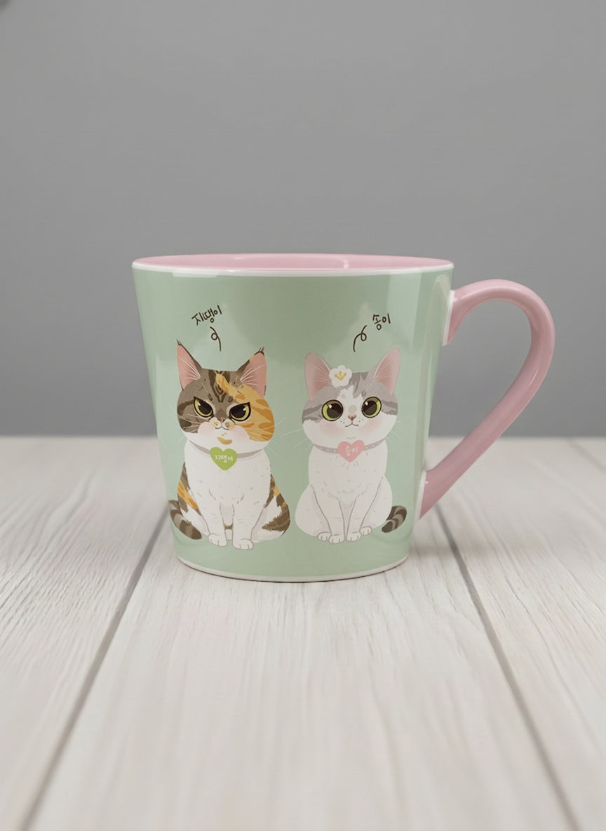 Conical Mug | The Perfect Pair mug two cats with Korean name tags and bow ties on mint green, blush pink interior, by Hyun Jung Cho