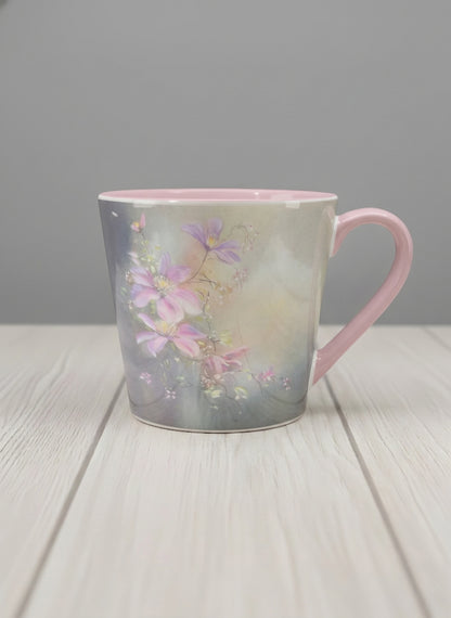 Conical mug | Ethereal Blossoms mug, soft pink clematis flowers glowing against a deep moody sage green mist, blush pink interior and handle, by Karina Mosser - Gallery By Inhesion