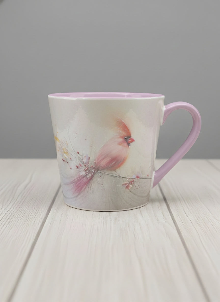 Conical mug | lossom Visitor mug, a delicate pink cardinal perched on a wispy blossom branch against a soft ivory mist, blush pink interior and handle, by Karina Mosser - Gallery By Inhesion