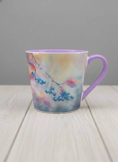 conical mug | Frosted Morning mug, vivid blue berries and autumn leaves drifting across a dreamy pastel rainbow wash, soft lavender interior and handle, by Karina Mosser - Gallery By Inhesion