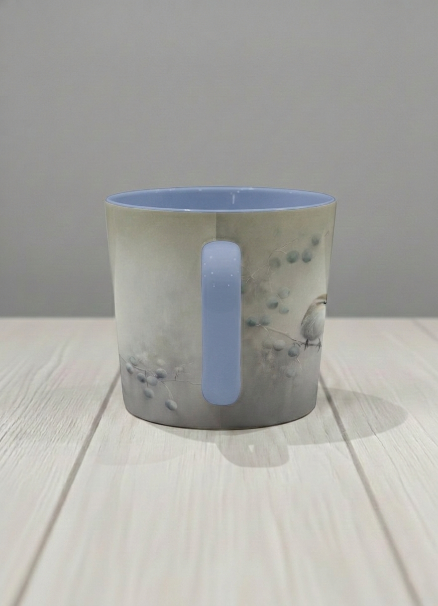 conical mug | A Quiet Moment side view mug,solitary bird perched in a soft misty landscape with delicate dot details, dusty blue interior and handle, by Karina Mosser - Gallery By Inhesion