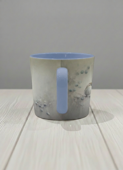 conical mug | A Quiet Moment side view mug,solitary bird perched in a soft misty landscape with delicate dot details, dusty blue interior and handle, by Karina Mosser - Gallery By Inhesion