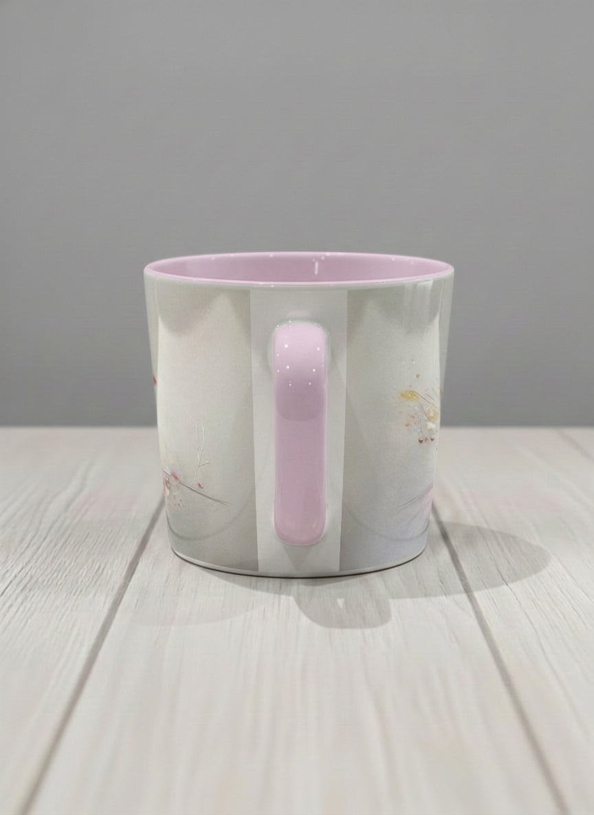 Conical mug | lossom Visitor side view mug, a delicate pink cardinal perched on a wispy blossom branch against a soft ivory mist, blush pink interior and handle, by Karina Mosser - Gallery By Inhesion