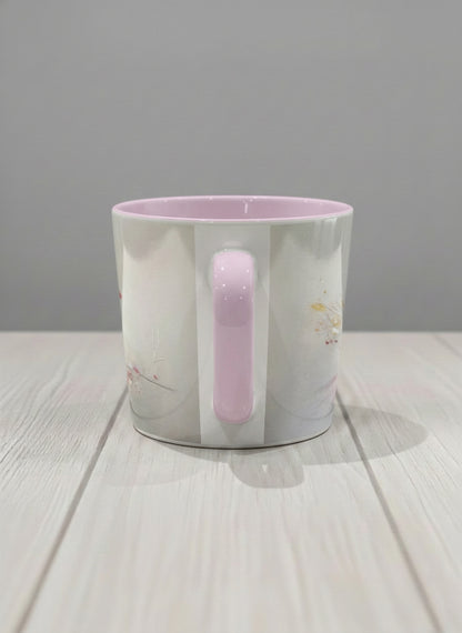 Conical mug | lossom Visitor side view mug, a delicate pink cardinal perched on a wispy blossom branch against a soft ivory mist, blush pink interior and handle, by Karina Mosser - Gallery By Inhesion