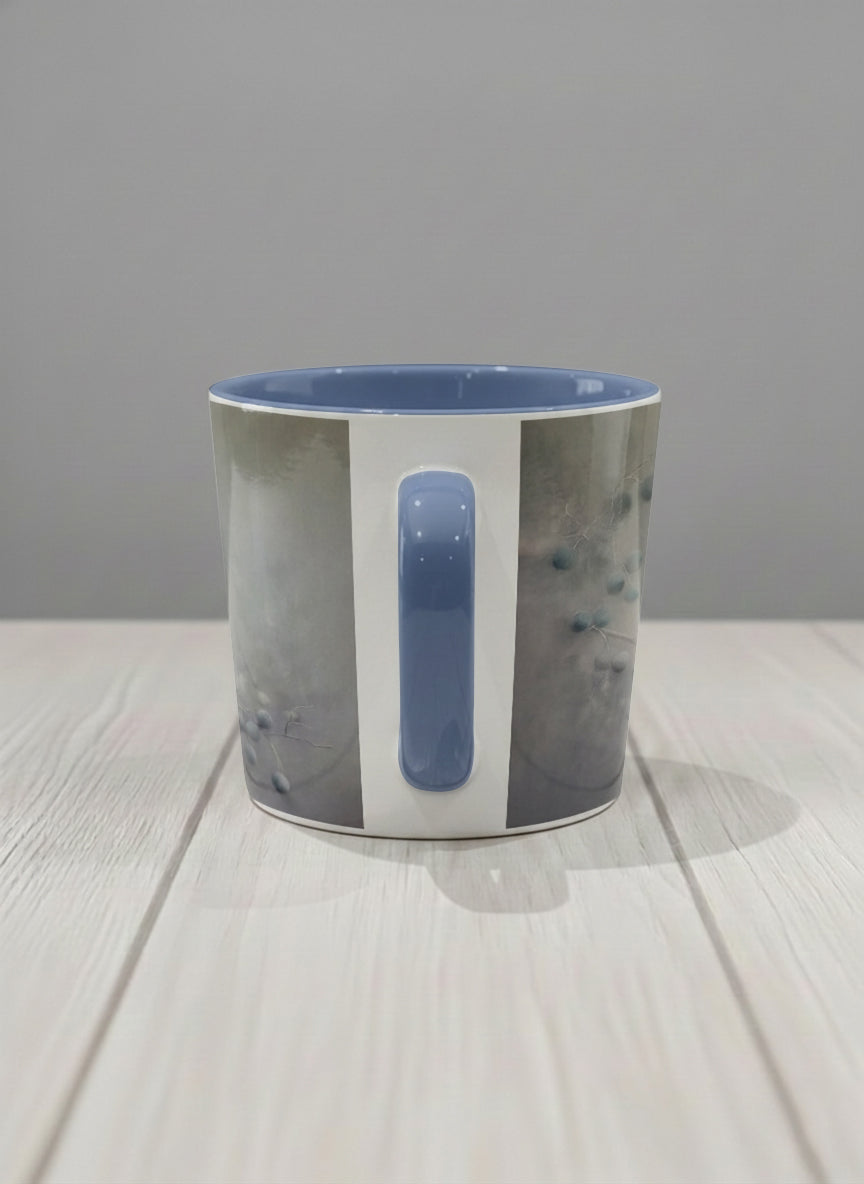 conical mug | A Quiet Moment side view mug, solitary bird perched in a soft misty landscape with delicate dot details, dusty blue interior and handle, by Karina Mosser - Gallery By Inhesion