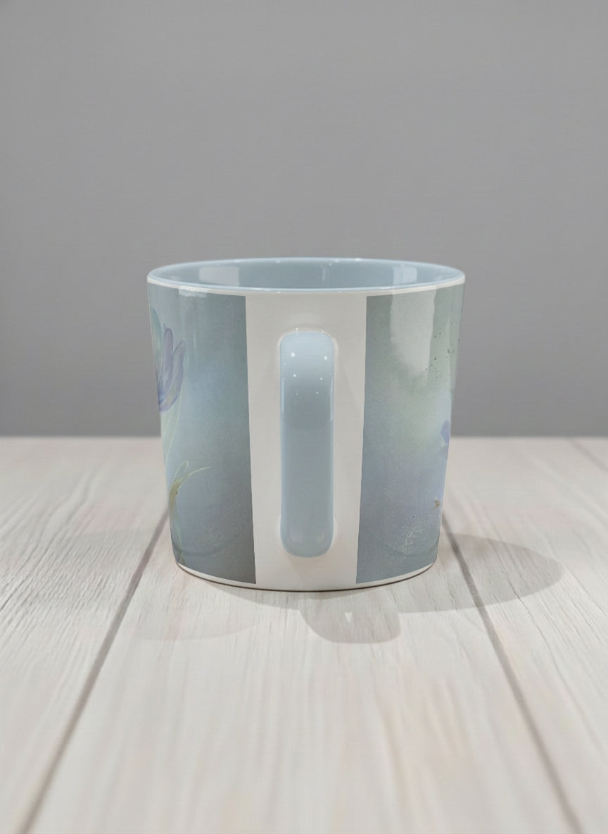conical mug | Glass Petals side view mug, a delicate translucent poppy bloom emerging from a soft misty blue-grey wash, matching powder blue interior and handle, by Karina Mosser - Gallery By Inhesion