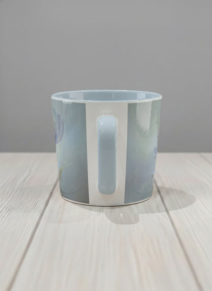 conical mug | Glass Petals side view mug, a delicate translucent poppy bloom emerging from a soft misty blue-grey wash, matching powder blue interior and handle, by Karina Mosser - Gallery By Inhesion