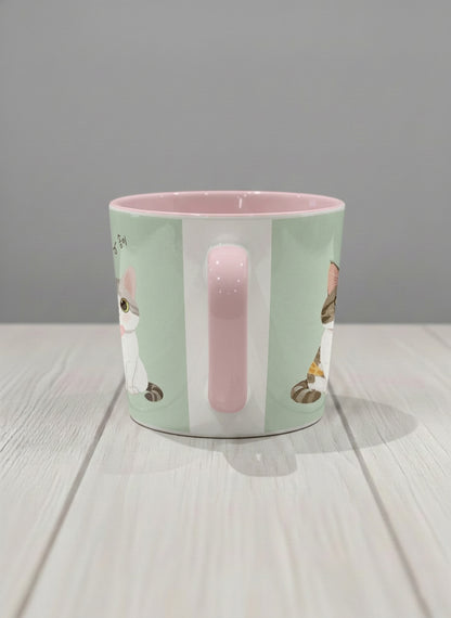 Conical Mug | The Perfect Pair side view mug two cats with Korean name tags and bow ties on mint green, blush pink interior, by Hyun Jung Cho