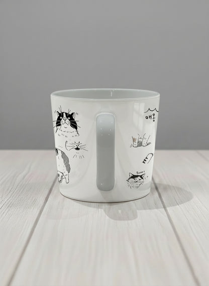 Conical mug | Moments of Curiosity side view mug  ink-sketched cats in playful poses with Korean script on white, grey interior, by Hyun Jung Cho