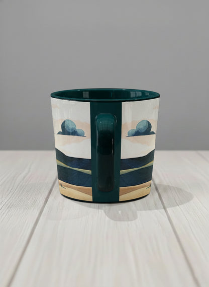 Conical mug | Share a Sunset side view mug a lone figure walking through rolling sand dunes beneath a glowing orange sun and layered teal clouds, deep teal interior and handle, by KikaG - Gallery By Inhesion