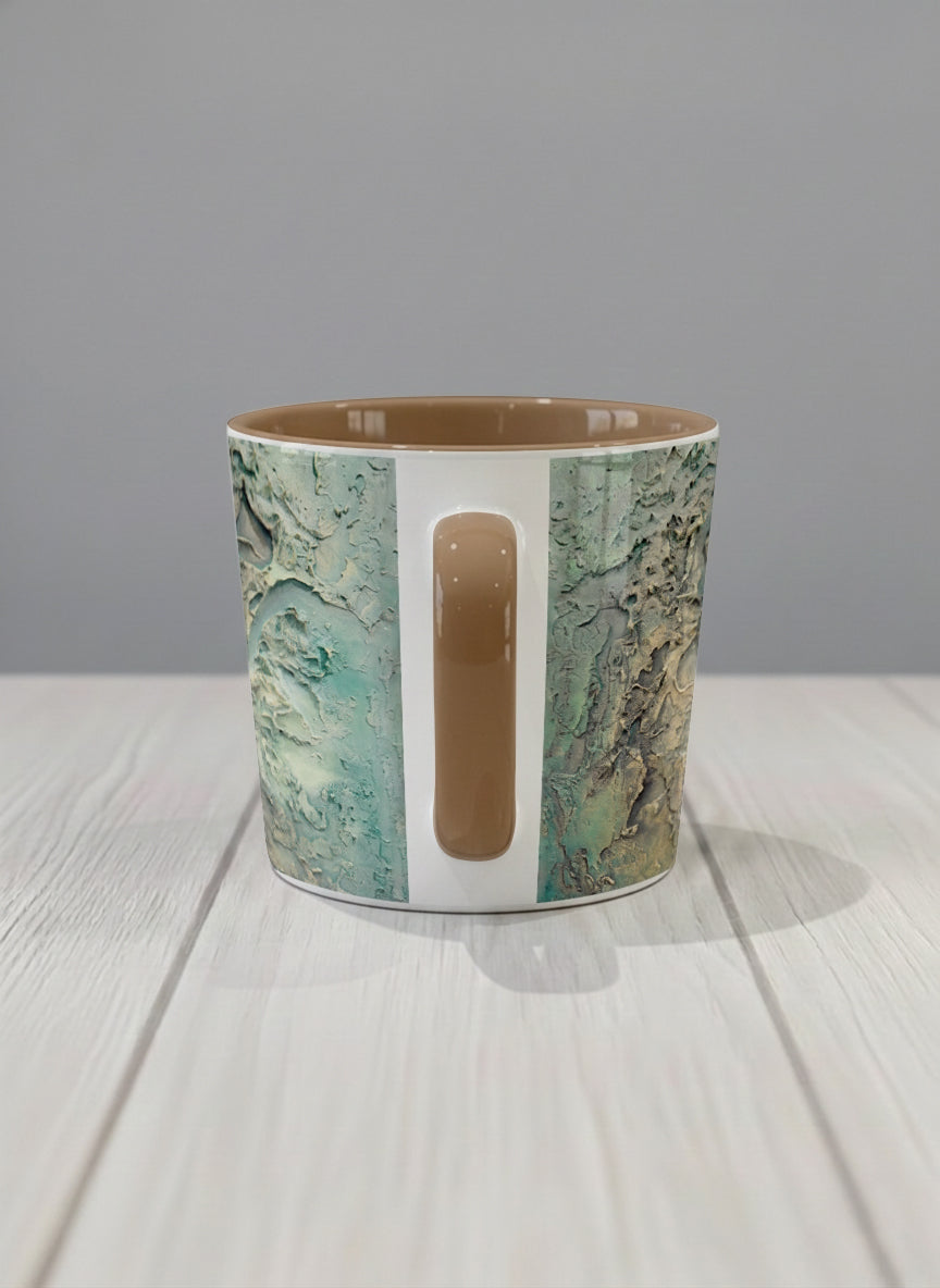 Conical Mug | Green textured side view mug with earthy, weathered pattern and brown handle on a light surface by Mersedes Mein - Gallery By Inhesion