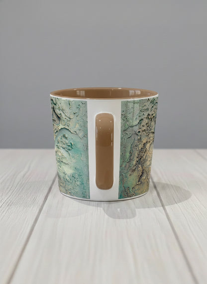Conical Mug | Green textured side view mug with earthy, weathered pattern and brown handle on a light surface by Mersedes Mein - Gallery By Inhesion