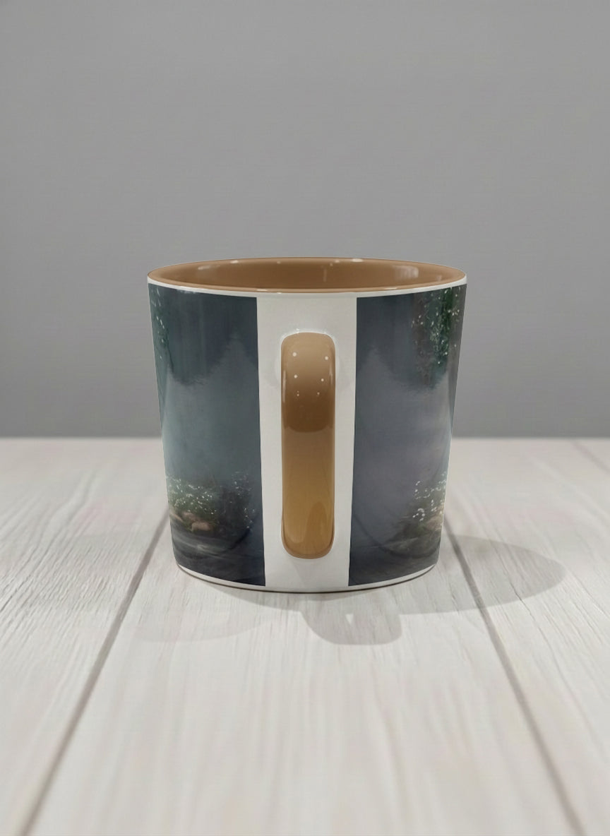 Conical mug | Serenity Stream side view mug, an enchanted forest with glowing light filtering through misty teal trees and wildflowers by a stream, warm olive interior and handle, by Karina Mosser - Gallery By Inhesion