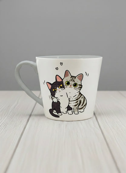 conical mug | Best Buddies left view mug small tuxedo cat leaning into a chubby tabby with tiny floating hearts, sage interior, by Hyun Jung Cho
