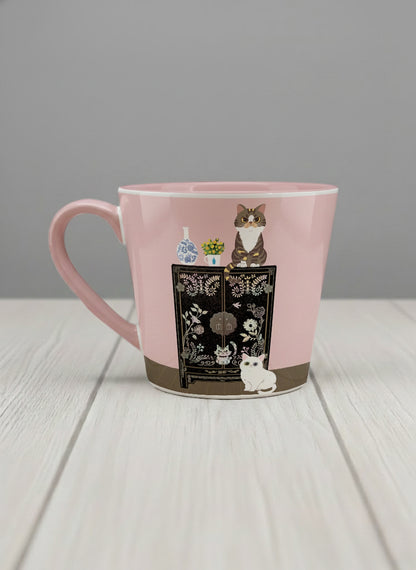 Conical Mug | Korean Beauty & Felines left view mug cats by ornate black lacquer cabinet with floral carvings, blush pink interior, by Hyun Jung Cho