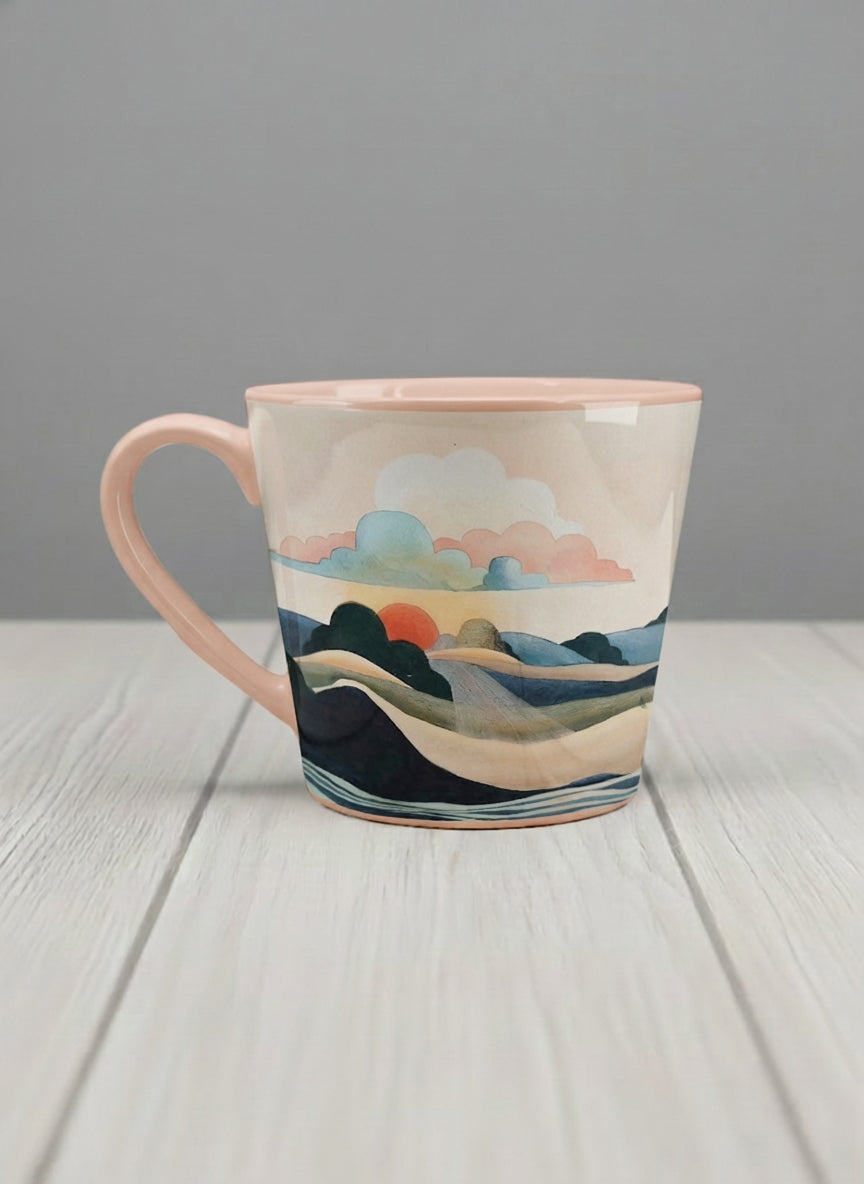 Conical mug | Sunset at the River left view mug rolling hills and dark treetops beneath a soft peach sky with blush and teal clouds and a glowing setting sun, warm peach interior and handle, by KikaG - Gallery By Inhesion