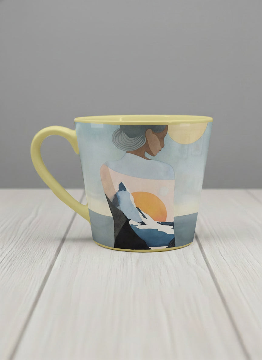Conical mug | A Mountain to Climb left view mug woman gazing over jagged peaks and a golden sun on teal horizon, butter yellow interior, by KikaG - Gallery By Inhesion
