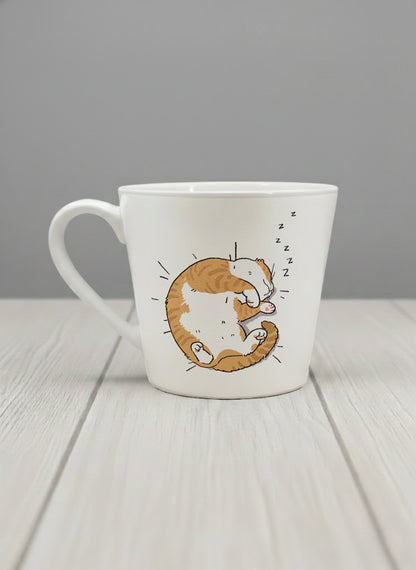 conical Mug | Sweet Dreams left view mug, a ginger tabby cat curled into a perfect circle fast asleep with tiny zzz's floating above, clean white interior and handle, by Hyun Jung Cho - Gallery By Inhesion