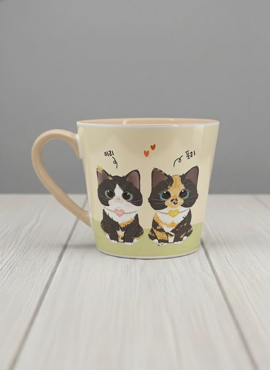 Conical mug | Our Precious Pair left view mug, two adorable tuxedo cats side by side with Korean name tags and tiny red hearts, soft cream interior and handle, by Hyun Jung Cho - Gallery By Inhesion