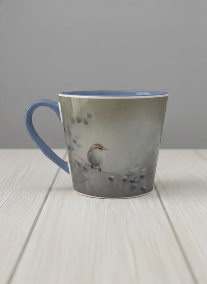 conical mug | A Quiet Moment left view mug, solitary bird perched in a soft misty landscape with delicate dot details, dusty blue interior and handle, by Karina Mosser - Gallery By Inhesion
