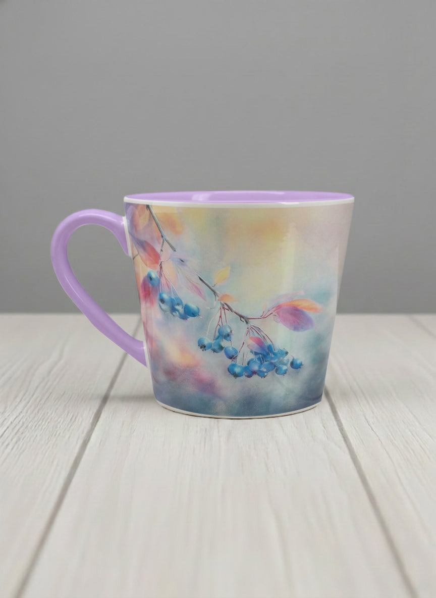 conical mug | Frosted Morning left view mug, vivid blue berries and autumn leaves drifting across a dreamy pastel rainbow wash, soft lavender interior and handle, by Karina Mosser - Gallery By Inhesion